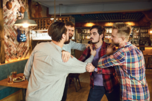 Four individuals getting into a heated argument inside a restaurant.