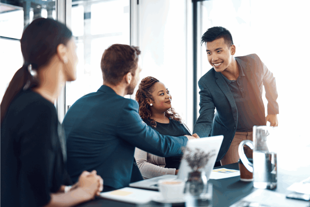 Business professionals discussing voluntary benefits in a modern office setting.